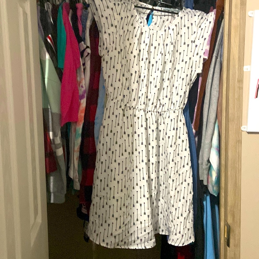 This is a SweetRain white dress with black arrows and it’s a medium.